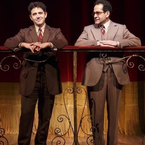 (Pictured here with costar Tony Shalhoub)