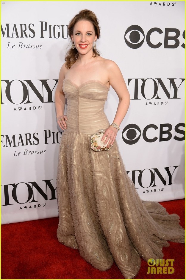The skirt of the gown is gorgeous. But dear God that bodice is so depressing. It makes her torso look much too long and the ruffle under her breast is not pleasant.