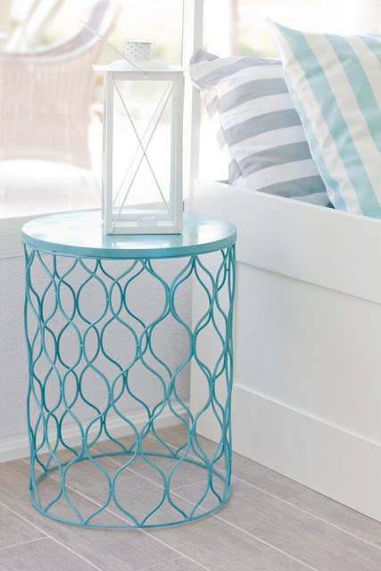 Spray paint the waste paper basket your favorite color, then flip it over for an affordable and compact piece of furniture.