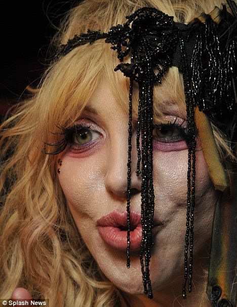 Courtney Love – Courtney may have proven she can rock as both a screeching solo artist as well as the lead singer of the band, Hole, but this photo suggests she may be more interested in eating brains than churning out hit singles these days.