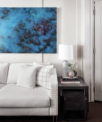Customize your cheap sofa with a sharpie and your dreams. Or just stick to pillow covers, which are less permanent. From here.