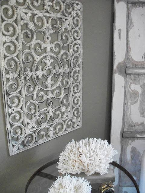 Put on a coat of paint, then sandpaper it for a bit. From here.