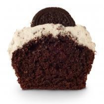 Chocolate cake topped with vanilla cream cheese frosting with crushed sandwich cookies mixed in and a whole cookie on top.
