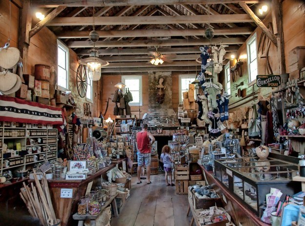 It's like a miniature Colonial Williamsburg, VA. You can visit shops, learn how to churn butter, and ride horses.