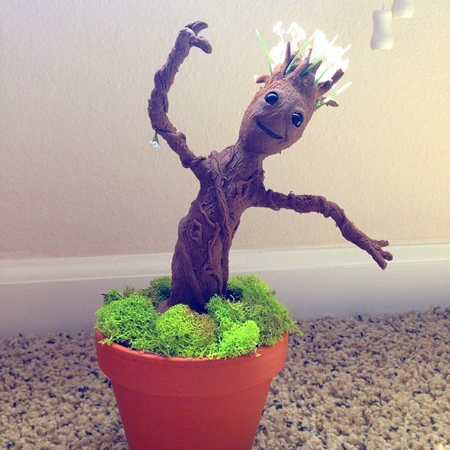 Behold, the Baby Groot. Made with some clay, trimmings from artificial flowers, and a tinfoil core.