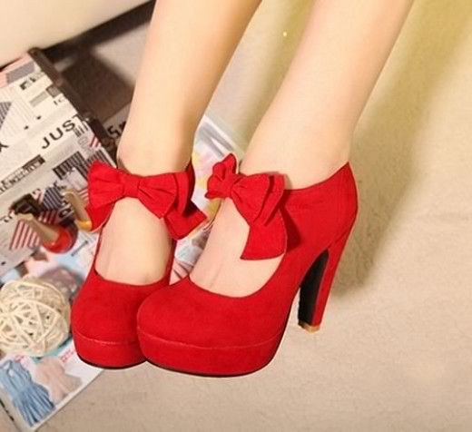 A lipstick red color, bow strap, and platform base gives these shoes a pin-up vibe.