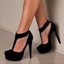 A velvet, black, t-strap platform accentuates the length of the leg. Ideal for a classic black gown.