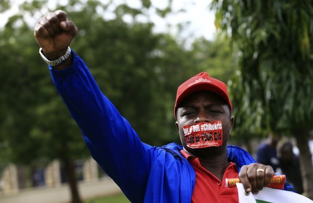 A protester raises his fist at a rally held in Abuja on Tuesday to mark 120 days since Boko Haram abducted more than 300 schoolgirls.