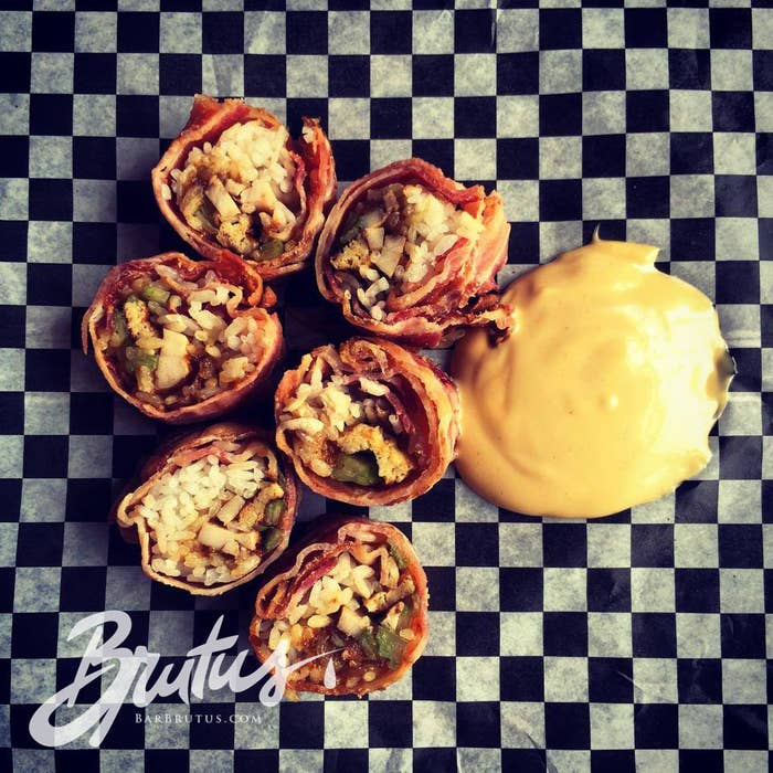 That's bacon wrapped around chicken confit, dates, and celery, topped with soy mayo, maple syrup, and Dijon mustard.