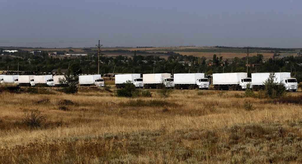 A Russian convoy of trucks carrying humanitarian aid for Ukraine drives in the direction of the Ukrainian border near Donetsk.