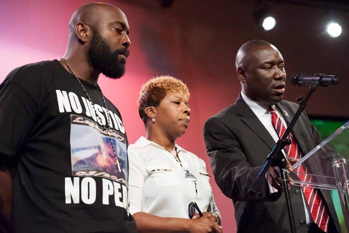 Lesley McSpadden (center) and Michael Brown Sr. (left), parents of 18-year-old Michael Brown.