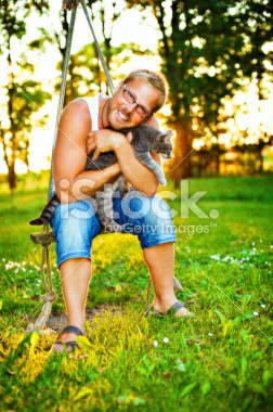 "Man cuddling with cat". Man: Oh kitty, I love you SO MUCH. NEVER LEAVE ME.Cat: Get. Me. The. F. Out. Of. His. Iron. Grasp.