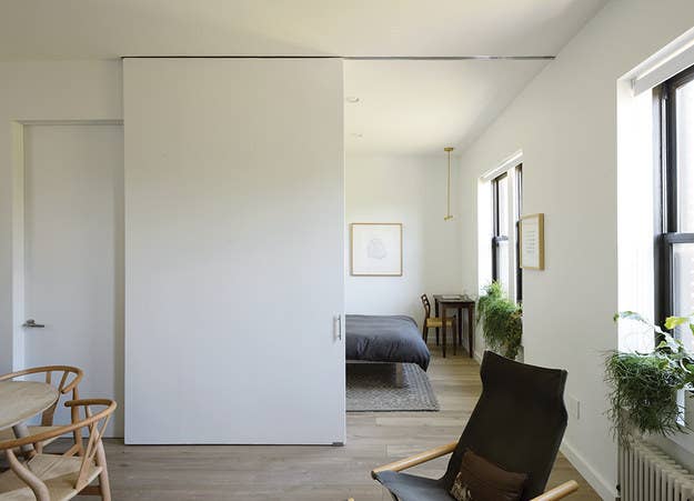 This Brooklyn apartment feels much larger than its 500 square feet, thanks to large sliding doors with wide doorways.