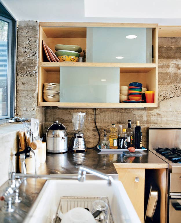 This tiny L.A. home went back to basics with cement walls and stainless steel countertops.