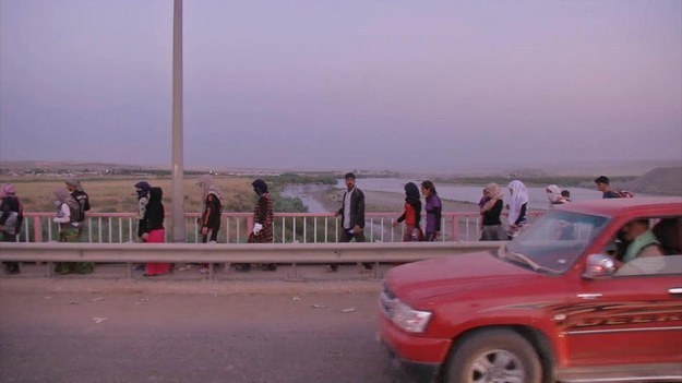 Iraqis from the Yazidi community arrive in Irbil in northern Iraq Aug. 3.