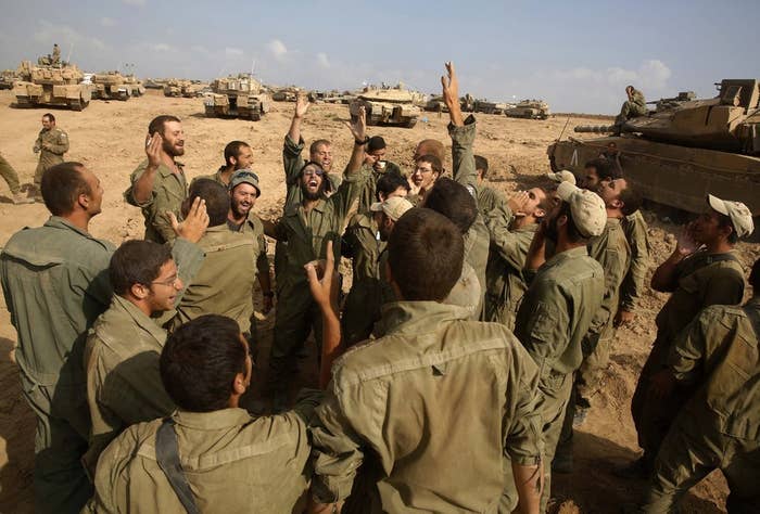 Israeli soldiers celebrate their return to Israel from Gaza.
