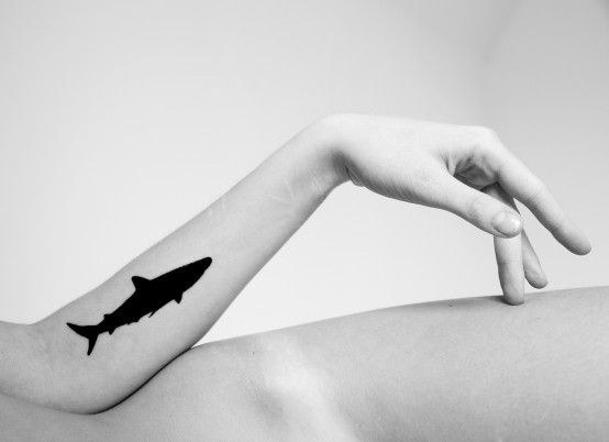 Single needle shark tattoo on the ankle