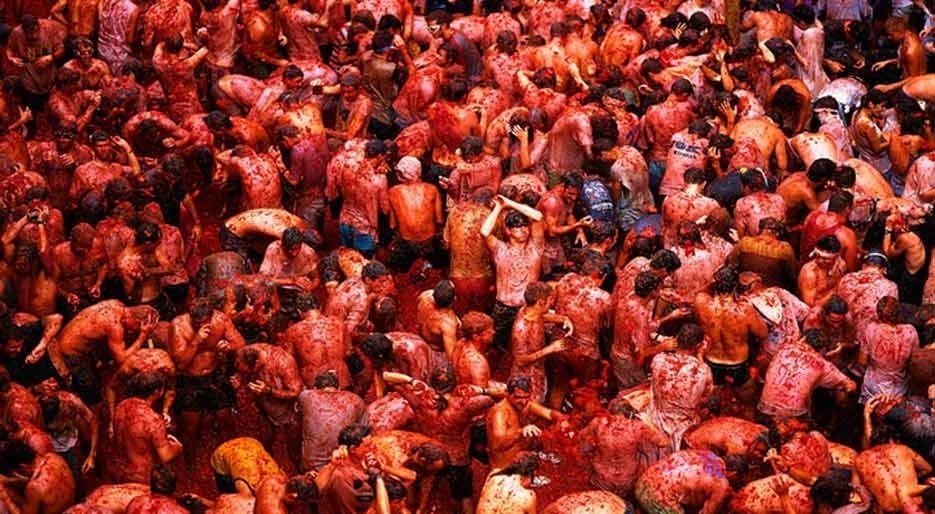 Go crazy and throw tomatoes like a crazy person by attending the super fun La Tomatina in Buñol, Spain. This festival happens only once a year, when for a few hours, thousands of people can literally whip truckloads of crushed tomatoes at one another.