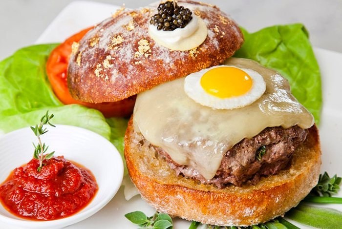 Only if you're on a budget though, Rich Kid. This burger only costs $295. So don't let anyone see you eating it. Le Burger Extravagant features staples like Japanese Waygu beef, caviar, black truffles, and a quail egg, and is available at our favorite Rich Kid takeout place: Serendipity 3.