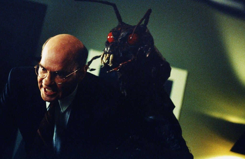 A giant bug monster that pretends to be a man goes around and turns people into his zombie slaves. He's left alone to find a few job elsewhere. How'd he get a new job?! Who checked is references?! He's a giant bug monster! Every former place of employment is riddled with complaints of zombies and giant bugs!