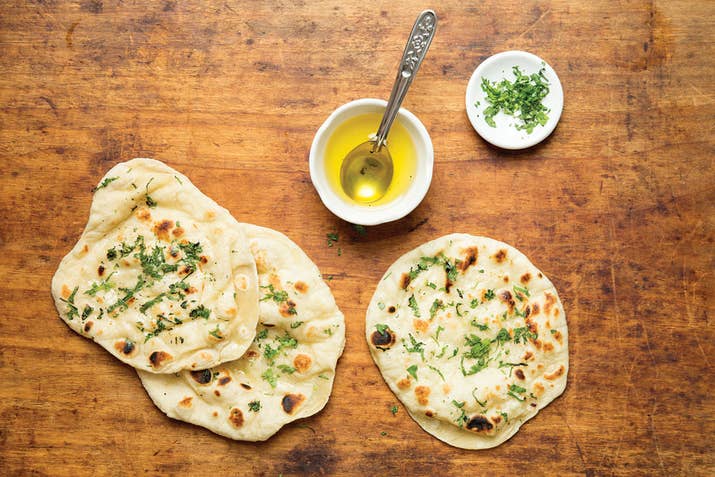 Naan is the bread you'll use to soak up all of the sauce left on your plate. It's usually pillowy soft, warm, and brushed with oil and herbs. You can customize your naan with a few different additions, and garlic is always a good way to go.Try making it at home with the recipe here.