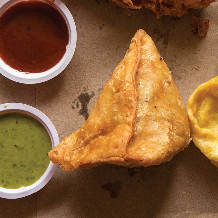 Think of samosas as being an Indian version of empanadas. These are a favorite appetizer made with with a flaky pastry enveloping a hearty filling of potatoes and vegetables. They're folded into triangles, fried, and served with chutneys.Try making it at home with the recipe here.