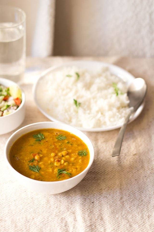 Chana dal is a dish consisting primarily of split chickpeas stewed with spices such as turmeric. Dal also refers to other legumes such as peas, kidney beans, and lentils, and it's possible you might also find these varieties on your restaurant menu.Try making it at home with the recipe here.