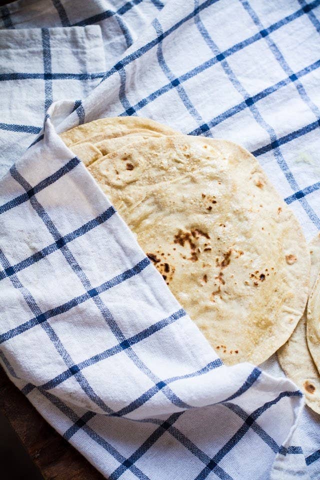 Roti is another type of flatbread, but because the dough doesn't contain any yeast, it's actually much thinner than naan. They're kind of like tortillas, and at some restaurants, they're even used to make curry wrap sandwiches.Try making it at home with the recipe here.