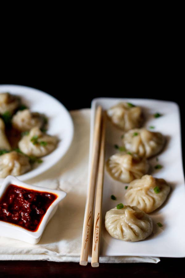 Momos are simply Indian dumplings. The spices used in the filling and sauce are more characteristic of Indian cuisine than Chinese cuisine, but like dumplings, momos are steamed or fried and come with a variety of vegetable and meat fillings.Try making it at home with the recipe here.