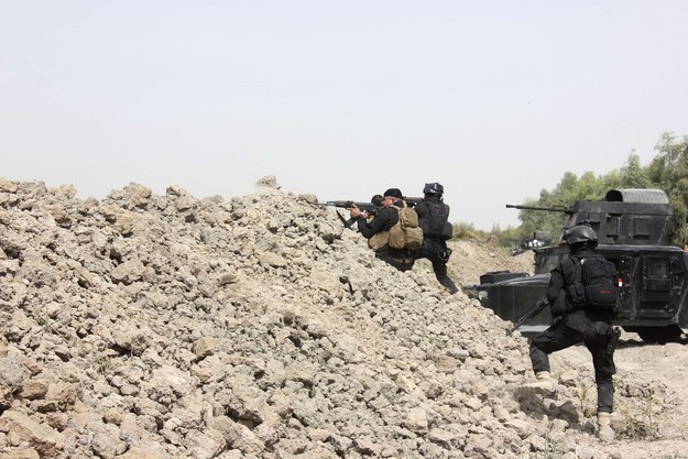 Iraqi SWAT troopers clash with ISIS militants north of Muqdadiyah in Diyala province last week.