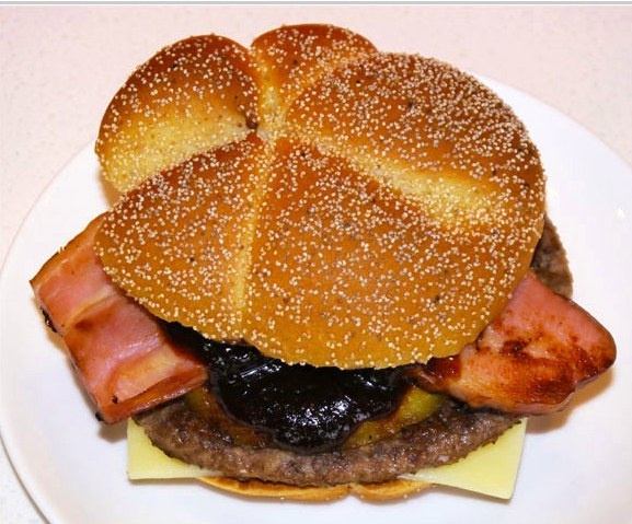 This one, known as the Quarter Pounder Gold Ring is one in a line of 'luxury, high class quarter pounders' and is served with bacon, a beef pattie, cheese, pineapple and a dollop of bbq sauce. You can read an extensive review here. Other burgers in the 'Quarter Pounder Jewelry Burgers' series include the 'Black Diamond' and 'Ruby Spark'.