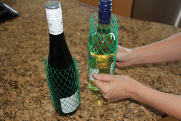 Plastic mesh sleeves around bottles of wine and liquor