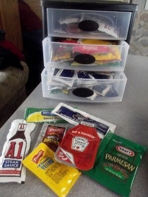 Plastic container full of free condiment packets