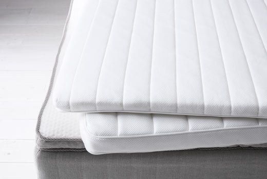 Add a foam or feather pillow-top pad to your mattress to make it softer.