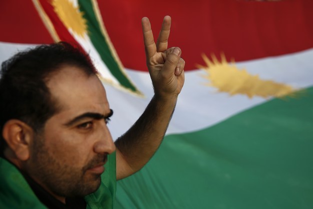A pro-Kurdish protester gestures during a rally in Athens, Greece showing solidarity with the town of Kobani yesterday.