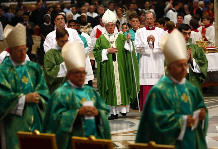 Pope Francis leaves at the end of a mass to mark the opening of the synod on the family in Saint Peter's Square at the Vatican October 5, 2014.