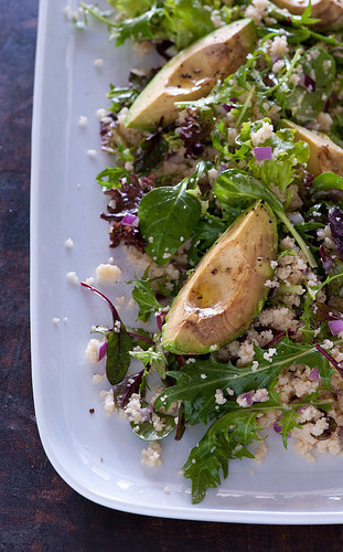 Avocado + cous cous + red onion + lemon juice + salad mix. Get the recipe here.