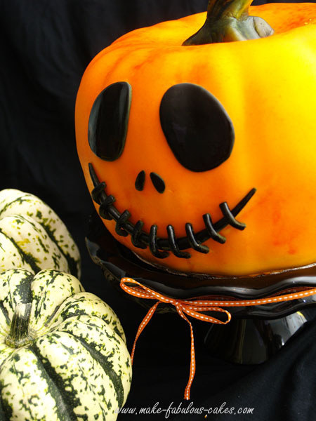 This amazing pumpkin cake comes with instructions, but unless you have professional-level cake making skills, might just want to look.