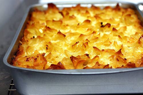 There's little not to like about these Jewish casseroles, usually served on Shabbat and holidays. Potato kugel is basically a giant, baked tater tot, while sweet noodle kugels will make you feel like you're eating dessert during the main course (as they should — they usually use a lot of sugar). Feel free to have fun with these by adding cinnamon and raisins to a noodle kugel, or using sweet potatoes instead of regular ones.
