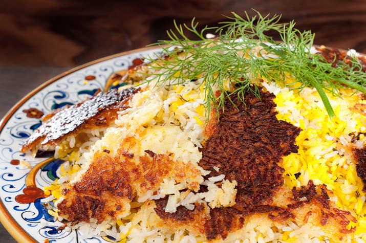 If you are a person who tends to accidentally burn your rice, then you especially need to learn how to do it the delicious Persian way: by making chelo with tahdig, a rice pilaf with crispy, burnt rice from the bottom of the pot. (Tahdig means "bottom of the pot" in Farsi.) There are a number of variations on this dish, like this dairy, vegetarian version, a dill and lima bean recipe, and even a potato tahdig because the only thing more delicious than one crispy carb is TWO crispy carbs.