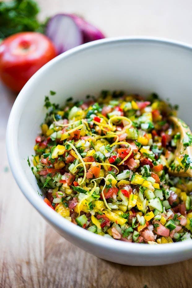 Like almost anything made in Israel, this salad has a controversial backstory — both an Israeli foodie and a Palestinian scholar have said that the salad was originally made by Palestinians, making the term "Israeli salad" a misnomer. But instead of letting this complicated history divide us, maybe this simple but zesty salad can bring us together? Try making the basic cucumber and tomato version, or add in some peppers.