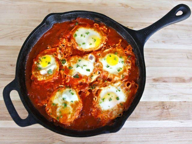 Tunisian Jews are credited for bringing shakshuka to Israel, but it's unclear where exactly the dish was first made. (Some say Tunisia, others say Libya.) These days, the egg dish is popular in a number of North African and Middle Eastern countries, including Algeria, Egypt, Iraq, Libya, and Morocco. It's basically eggs poached in a spicy tomato sauce, but there are tons of variations. Classic recipe here, Caprese version here, and a green version here.