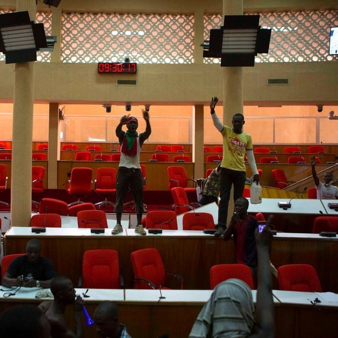 Anti-government protesters enter the parliament building in Ouagadougou