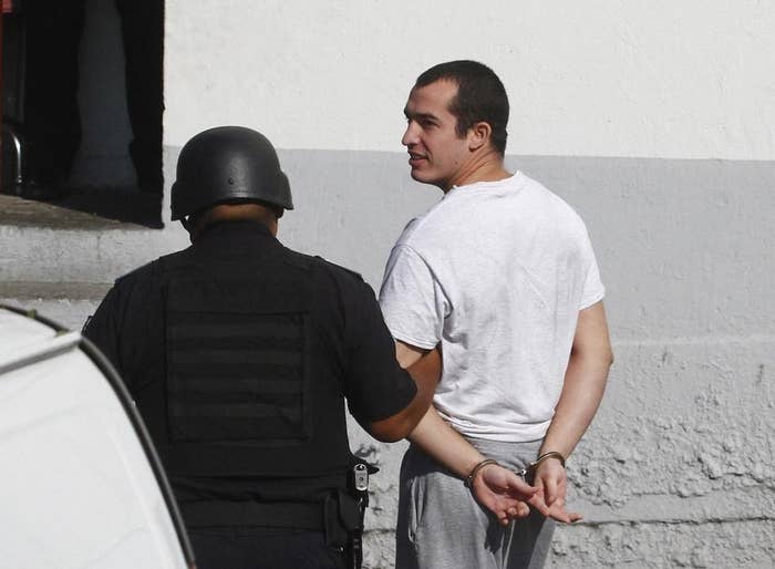 Former U.S. Marine Andrew Tahmooressi (R) is escorted to a federal court in Tijuana August 4, 2014.