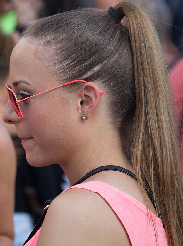 Carefully glued into place with hairspray.Oh, but don't forget to leave two thin strands out around your face. That just makes this look.