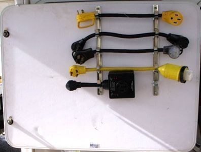 Metal racks holding electrical adapters