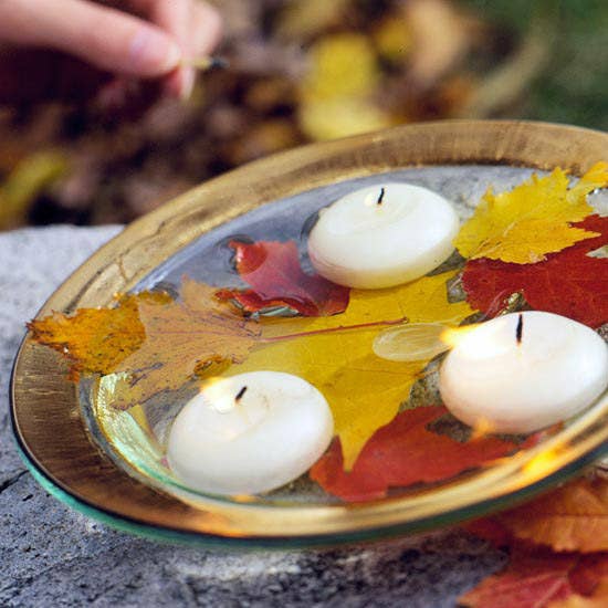 Fill a decorative bowl with water. Add leaves and candles. DONE.