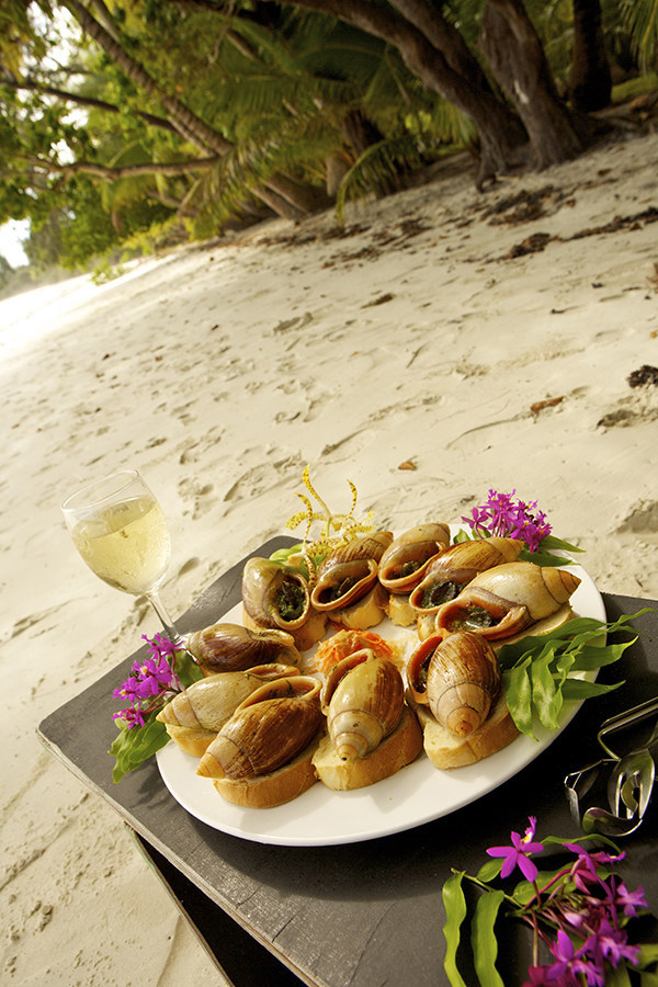 You'll sample incredible French cuisine on the island, as well as magnificent French wines and champagnes, baguettes, macarons, éclairs, and chocolates.