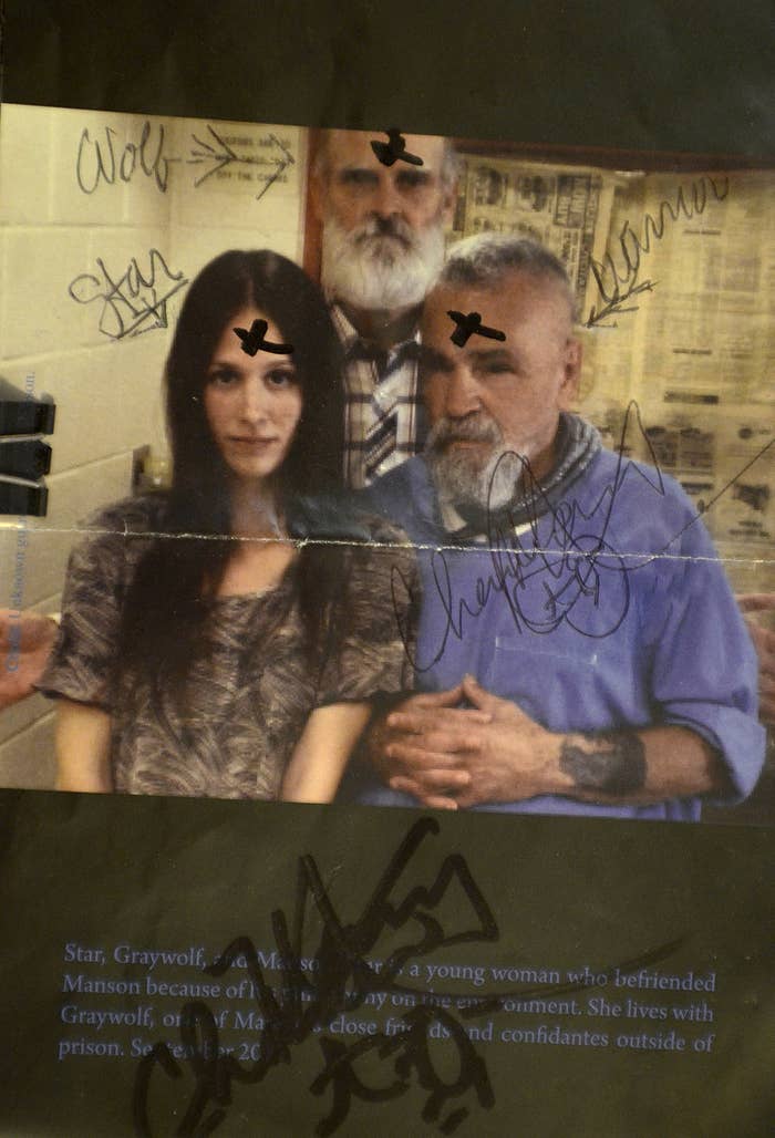 Charles Manson, right, autographed a photo in 2013 of himself with Star, and a friend, for one of his correspondents.