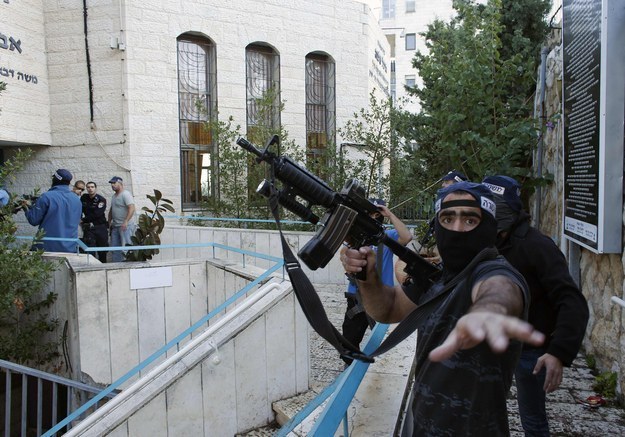 An Israeli police officer near the scene of an attack on a Jerusalem synagogue Tuesday morning.